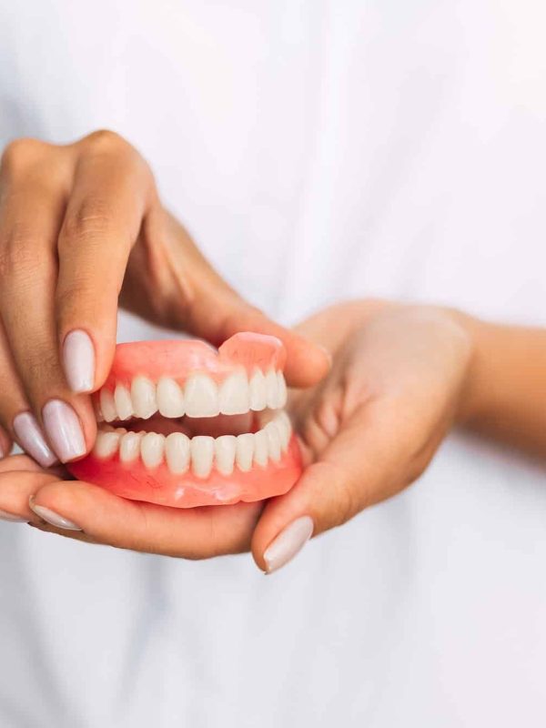 Front view of complete denture. Dentistry conceptual photo. Prosthetic dentistry. False teeth
